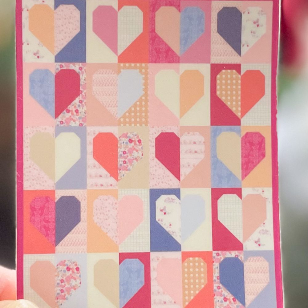 Colorful patchwork quilt of heart squares.