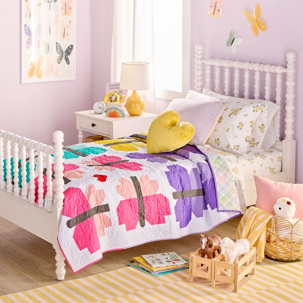 Colorful kids bedroom with heart pillow and decor.